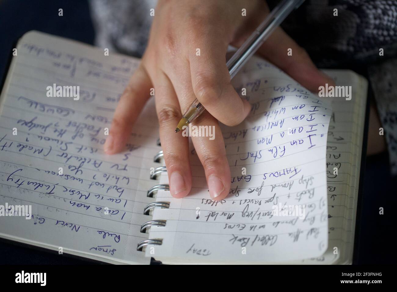 Woman`s hands writing with a pen Stock Photo